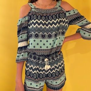 Girls blue patterned romper/jumper.